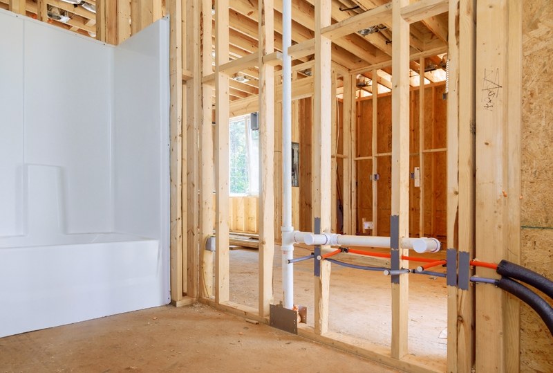 Hempstead Plumber installing bathroom plumbing during a remodel
