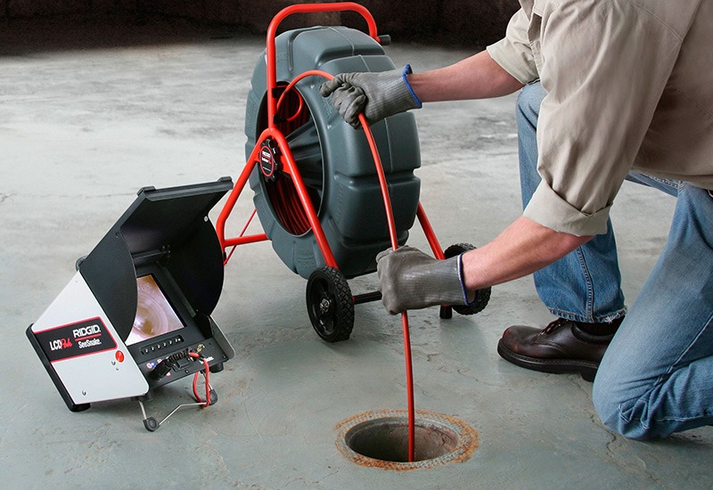 Hempstead Plumber clearing a residential drain on Long Island