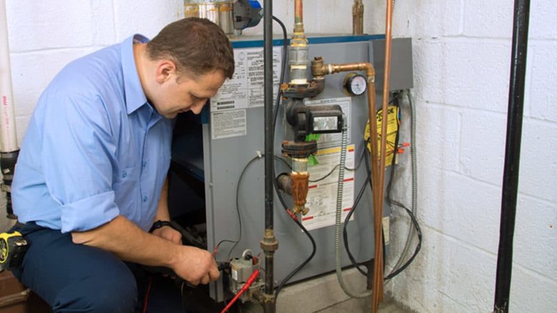 Hempstead Plumber installing a new gas boiler in a Long Island home